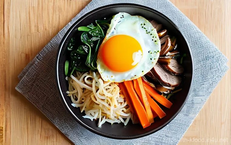 한식 비빔밥 레시피 - **A Vibrant and Perfectly Arranged Bibimbap Bowl.**
    A high-resolution, top-down food photography...